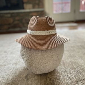 New Pretty straw hat with decorative band.
